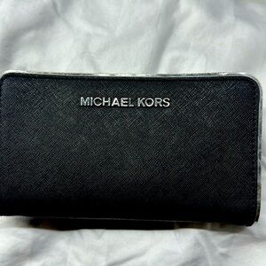 Black Michael Kors wristlet mini purse fits all cell phones